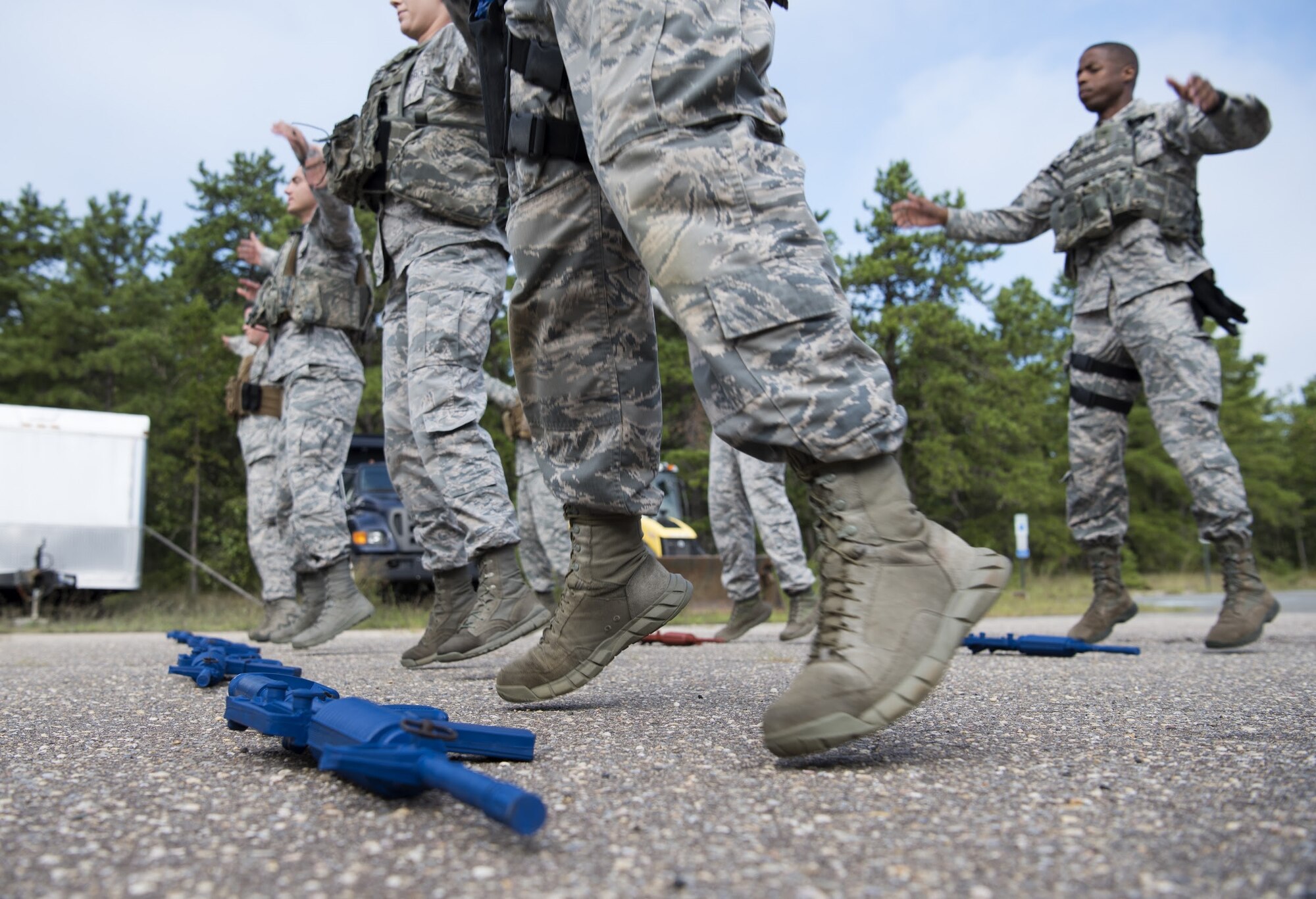 Security forces Airmen with Air Mobility Command exercise while training on Joint Base McGuire-Dix-Lakehurst, New Jersey, Sept. 5, 2018. The team spent three weeks preparing for the 2018 Air Force Defender Challenge that tested security forces Airmen’s skills through weapons scenarios, dismounted operations and combat endurance. (U.S. Air Force photo by Airman Ariel Owings)