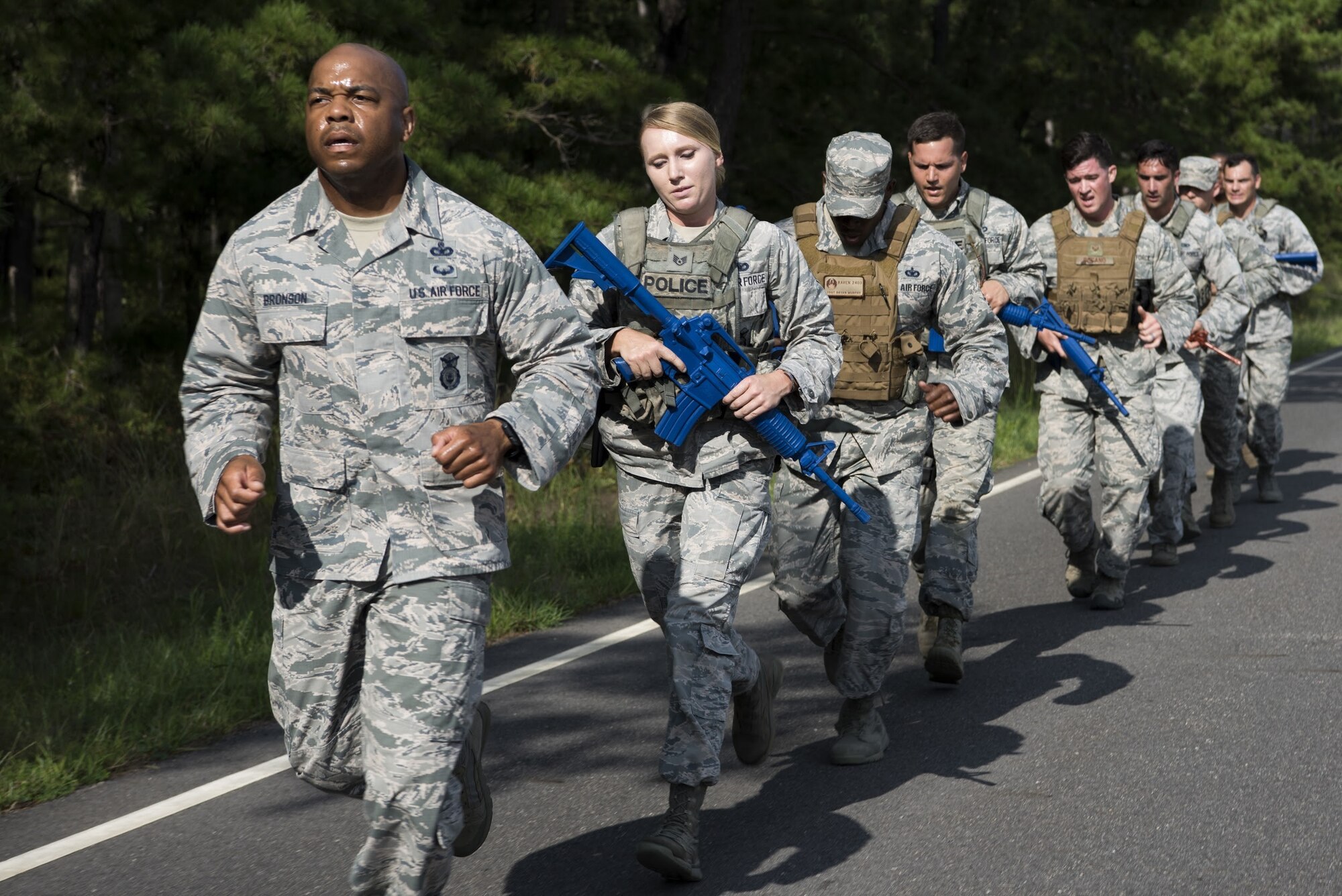 Security forces Airmen with Air Mobility Command train on Joint Base McGuire-Dix-Lakehurst, New Jersey, for the 2018 Air Force Defender Challenge Sept. 5, 2018. To qualify for the competition, security forces members tried out by completing a 6-mile run carrying 25-35 pounds in under two hours; a stress shoot with an M4 carbine and M9 pistol; a CrossFit Hero workout; a test of their reaction to near and far ambushes; an obstacle course; and field operations fire team movements. (U.S. Air Force photo by Airman Ariel Owings)