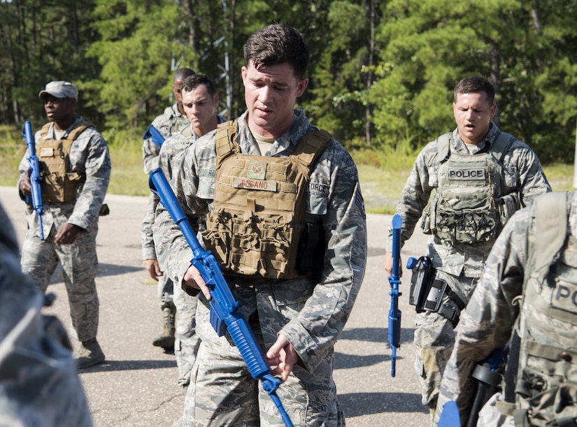 Security forces Airmen with Air Mobility Command catch their breath after training on Joint Base McGuire-Dix-Lakehurst, New Jersey, for the 2018 Air Force Defender Challenge Sept. 5, 2018. The team was comprised of four members who competed against other Airmen in AMC to determine who was the best and would represent the major command.