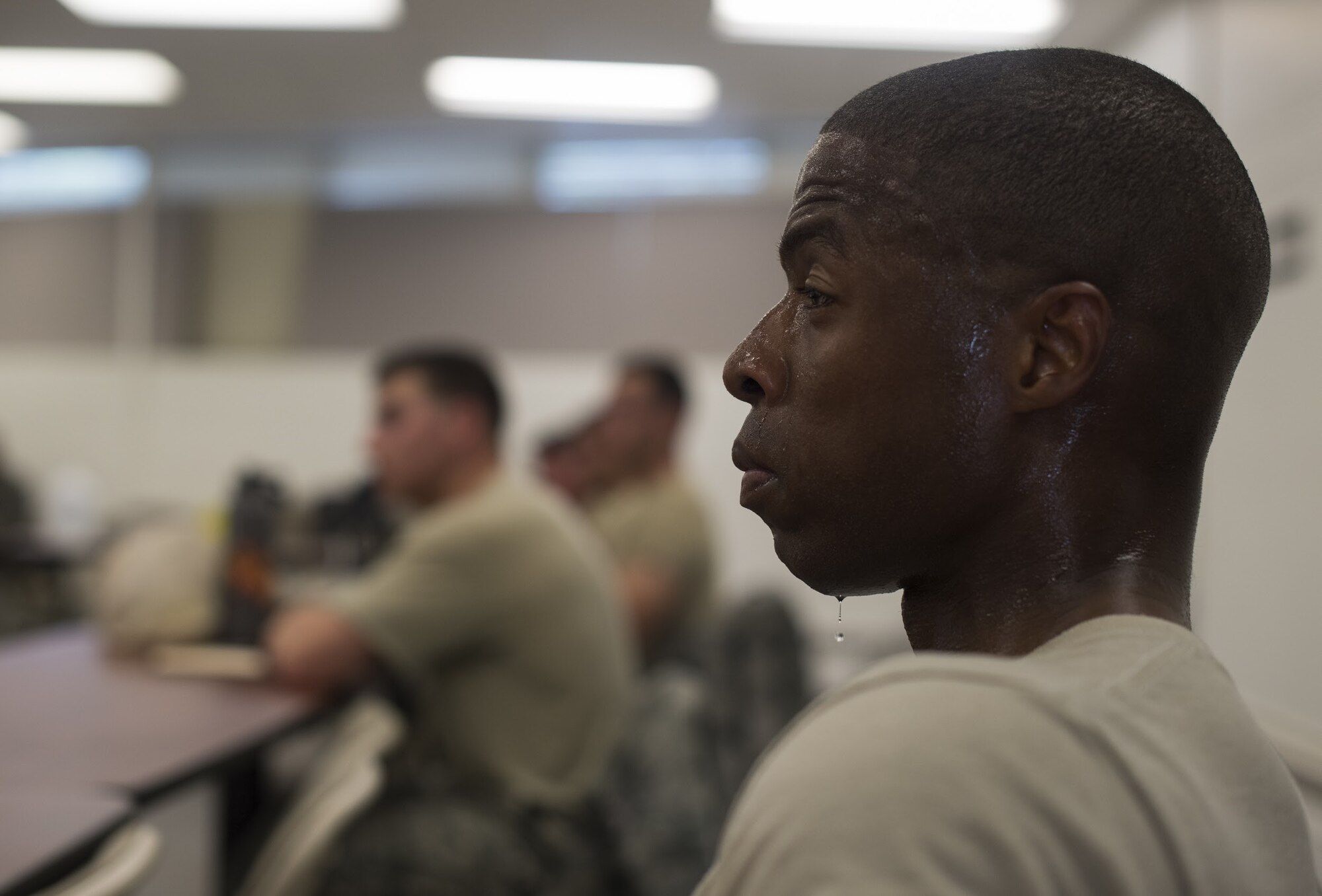 A bead of sweat drips off the chin of U.S. Air Force Staff Sgt. Zachary Everett, Dover Air Force Base, Delaware, 436th Security Forces Squadron response force leader, after a ruck march during his preparation for representing Air Mobility Command in the 2018 Air Force Defender Challenge on Joint Base McGuire-Dix-Lakehurst, New Jersey, Sept. 5, 2018. During training, professional military standards were held to the highest standards. If team members failed to meet them, additional physical training was added for the entire team to complete.