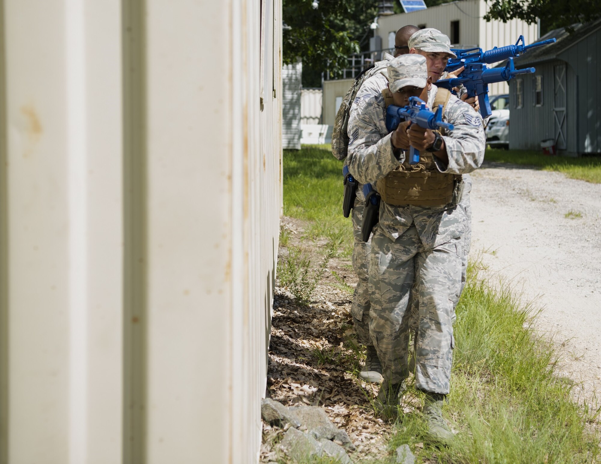 U.S. Air Force Staff Sgt. Bryan Murphy, 421st Combat Training Squadron Phoenix Raven instructor, leads his team through close quarter combat training during preparation for representing Air Mobility Command in the 2018 Air Force Defender Challenge on Joint Base McGuire-Dix-Lakehurst, New Jersey, Sept. 5, 2018. The exercise taught the Airmen how to tactically approach scenarios as a team when extracting prisoners of war.