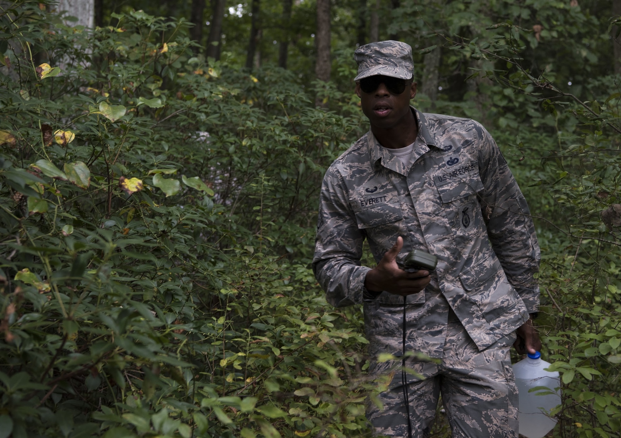 U.S. Air Force Staff Sgt. Zachary Everett, Dover Air Force Base, Delaware, 436th Security Forces Squadron response force leader, follows a GPS during land navigation training on Joint Base McGuire-Dix-Lakehurst, New Jersey, in preparation for representing Air Mobility Command in the 2018 Air Force Defender Challenge, Sept. 7, 2018. Land navigation was part of the dismounted operations portion of the competition, which the AMC team won. Each team was comprised of four main competitors and two alternatives and selected based on their performance and progression when the teams first began training.