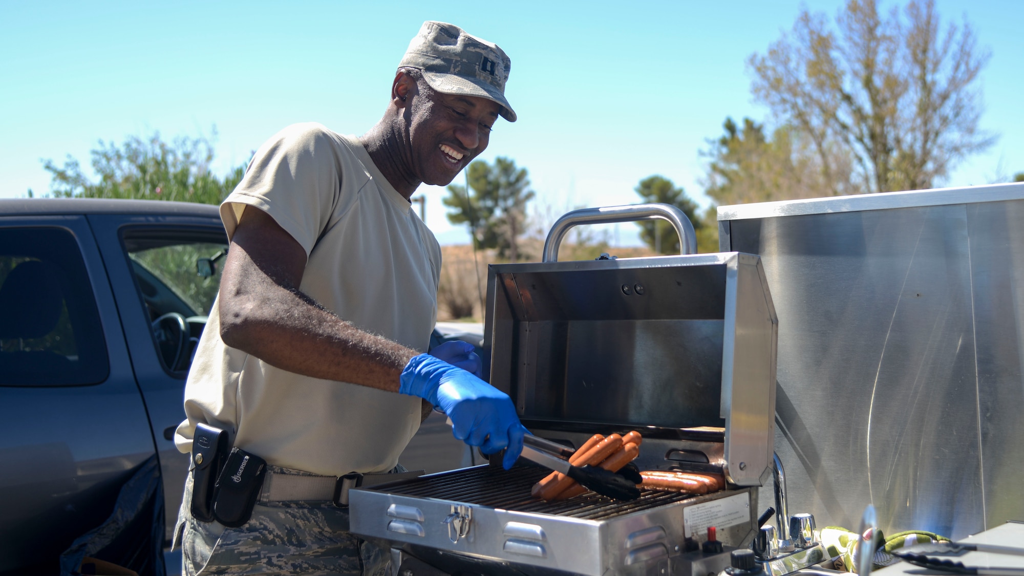 Chaplain (Capt.) Richardson Honore, 412th Security Forces Squadron, grills hot dogs for SFS Airmen at Edwards Air Force Base, California, Sept. 23, 2018. (U.S. Air Force photo by Giancarlo Casem)