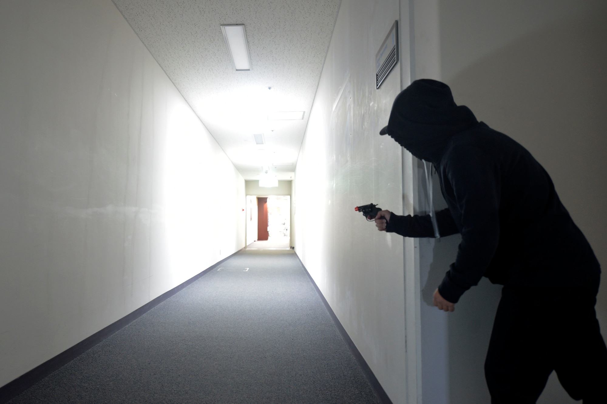 U.S. Air Force Senior Airman Dianna Schgeta, a 35th Security Forces Squadron unit scheduler, simulates being an active shooter during an active shooter exercise at Misawa Air Base, Sept. 18, 2018. Active shooter exercises are held to evaluate the 35th Fighter Wing's ability to correctly notify the base population of an active shooter in a timely manner and effectively report unit accountability. (U.S. Air Force photo by Tech. Sgt. Stephany Johnson)