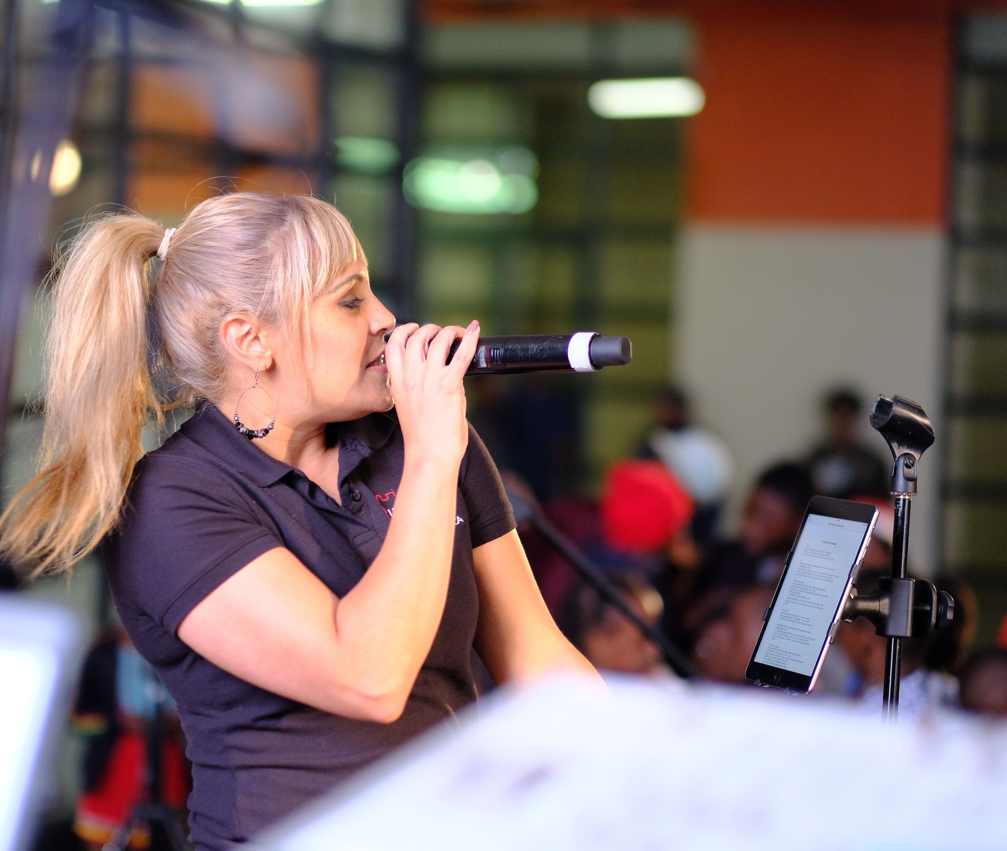 Senior Airman Linda Casul, the vocalist in the United States Air Forces in Europe -– Air Forces Africa band Touch ’n Go, sings for children during a concert at Ponte City in Johannesburg, South Africa, September 21, 2018. The band’s performance provides a unique opportunity for the U.S. to build strong ties with its African partners and their communities.  (US Army Photo by Staff Sgt. Jeffery Sandstrum)