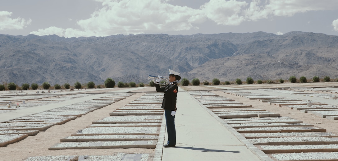 Following a funeral service for Tech. Sgt. Dorothy L. Angil, a Marine with Headquarters Battalion plays ‘Taps’ at the Twentynine Palms Public Cemetery, Twentynine Palms, Calif., Sept. 22, 2018. Angil enlisted in the Marine Corps in 1943, in support of World War II. She also went on to support the Korean War war effort.