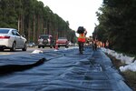 U.S. Army Soldiers from the South Carolina Army National Guard’s Alpha Company, 1st Battalion, 118th Regiment carry hoses to set up an AquaDam on Highway 17 in Georgetown County, S.C., Sept. 25, 2018. The Soldiers are assisting South Carolina Department of Transportation with setup of the AquaDam to keep roads open during the rising waters in the area after Hurricane Florence.