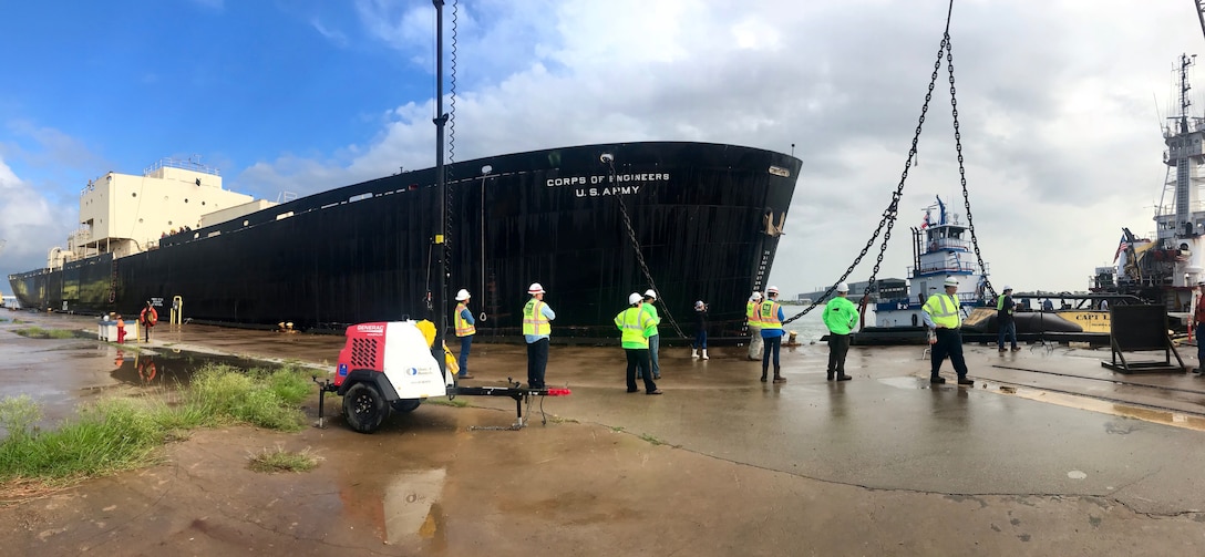 Members of the project team watch from the pier Tuesday morning September 25, 2018 as crews finish the rigging necessary for STURGIS to be towed from Galveston, Texas to Brownsville, Texas for her final shipbreaking and recycling. Over the past three years in Galveston, Texas, the U.S. Army Corps of Engineers has been implementing the challenging and complex efforts to decommission the MH-1A — the deactivated nuclear reactor that was onboard the STURGIS vessel.