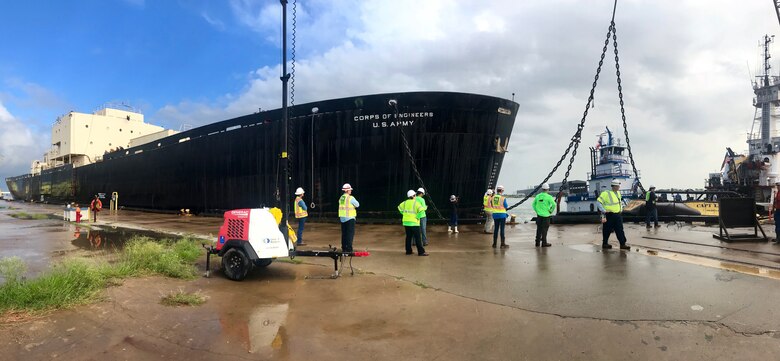Members of the project team watch from the pier Tuesday morning September 25, 2018 as crews finish the rigging necessary for STURGIS to be towed from Galveston, Texas to Brownsville, Texas for her final shipbreaking and recycling. Over the past three years in Galveston, Texas, the U.S. Army Corps of Engineers has been implementing the challenging and complex efforts to decommission the MH-1A — the deactivated nuclear reactor that was onboard the STURGIS vessel.
