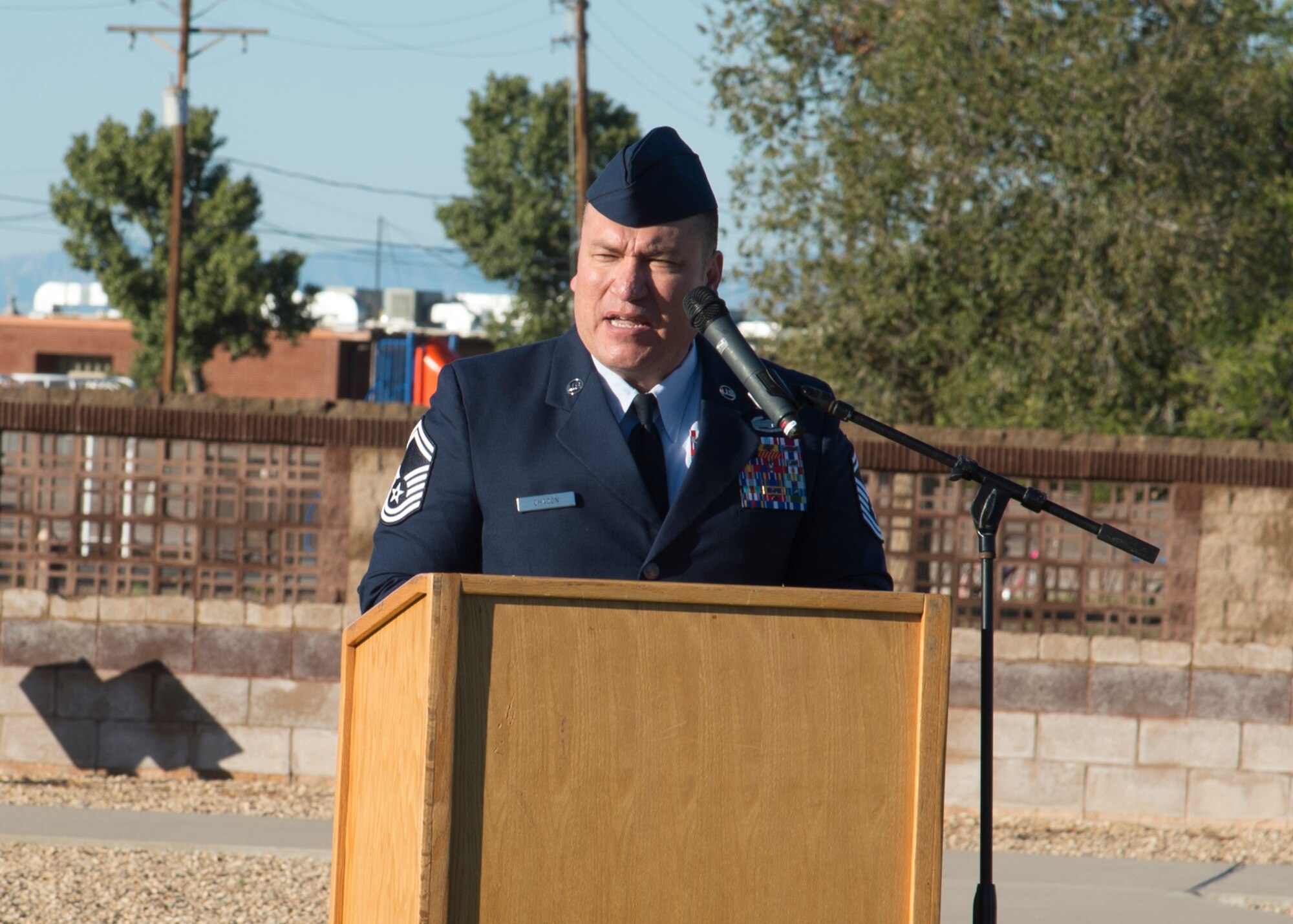Senior Master Sgt. John Chacon, 49th Civil Engineer Squadron operations superintendent, speaks at the POW/MIA ceremony at Heritage Park on Holloman Air Force Base, N.M., Sept. 21. The ceremony, in rememberance of prisoners-of-war and those still missing-in-action, was part of Holloman's POW/MIA commemoration. (U.S. Air Force photo by Airman 1st Class Kindra Stewart)