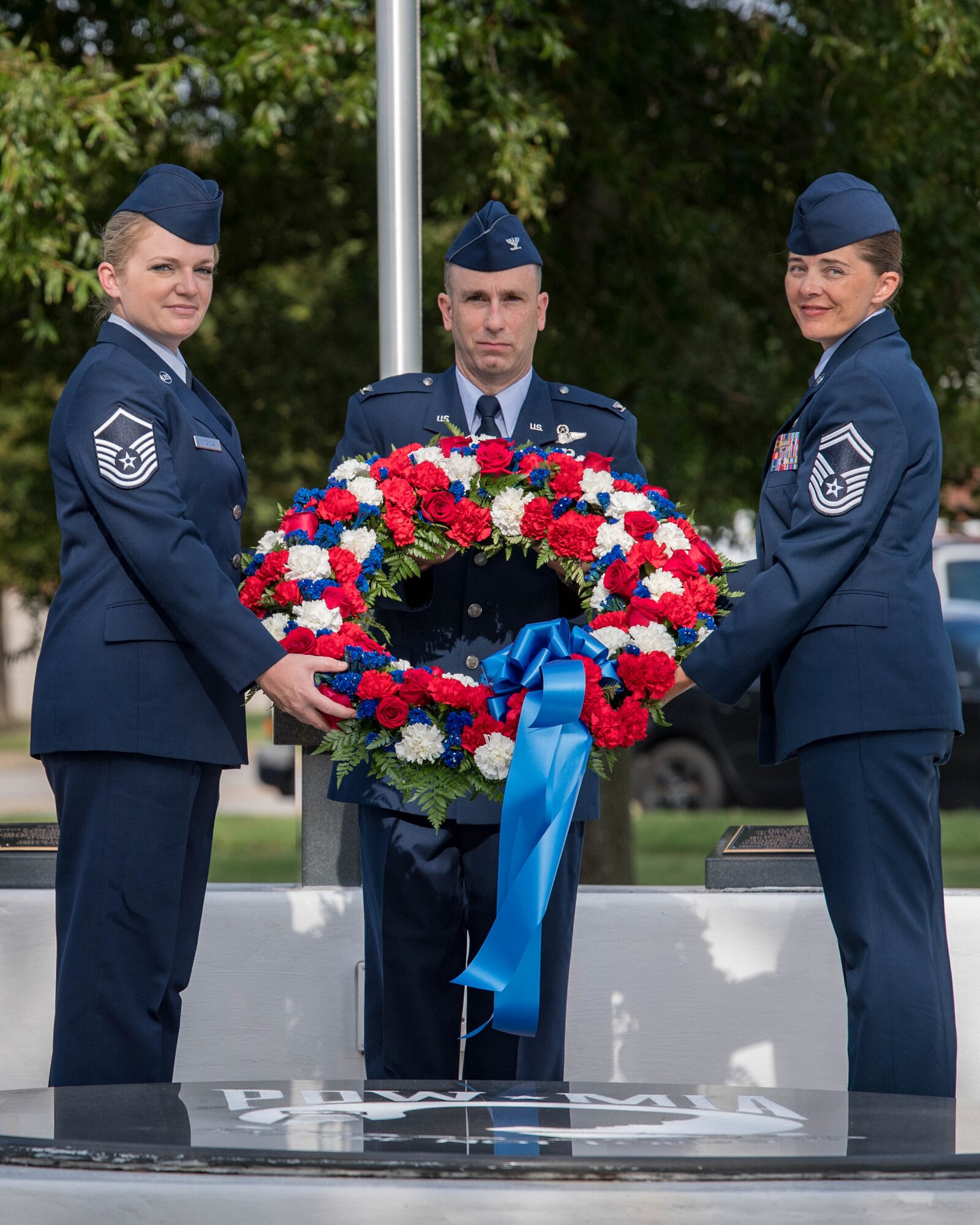 U.S. Air Force Master Sgt. Sharon Nichols, Air Combat Command Directorate of Air and Space Operations command and control manager, Col. Steven Fino, 1st Fighter Wing vice commander, and Senior Master Sgt. Vanessa Johnston, ACC Intelligence Directorate, 1A8XX Air Force Specialty manager, lay a wreath during the POW/MIA 24-hour Recognition Run closing ceremony at Joint Base Langley-Eustis, Virginia, Sept. 21, 2018.