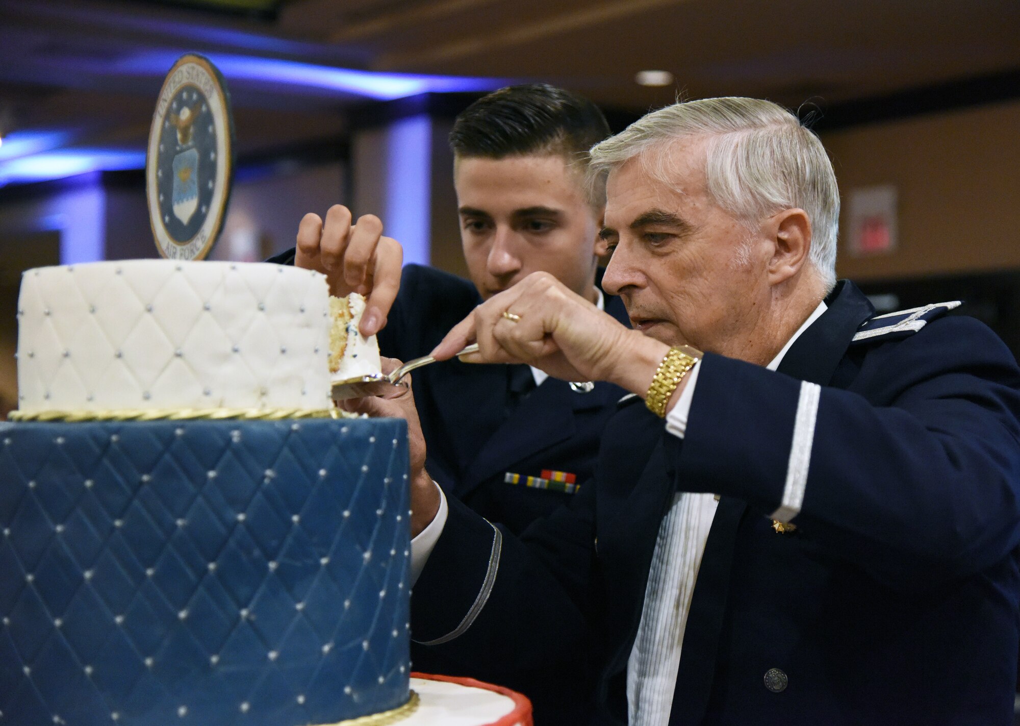 U.S. Air Force Airman 1st Class Warren Crouch, 334th Training Squadron student, and retired Col. Thomas Adams, participate in a cake cutting ceremony the U.S Air Force 71st Birthday Ball at the Imperial Palace Casino, Biloxi, Mississippi, Sept. 22, 2018. The event was hosted by the 81st Training Wing and the John C. Stennis Chapter Air Force Association. (U.S. Air Force photo by Kemberly Groue)
