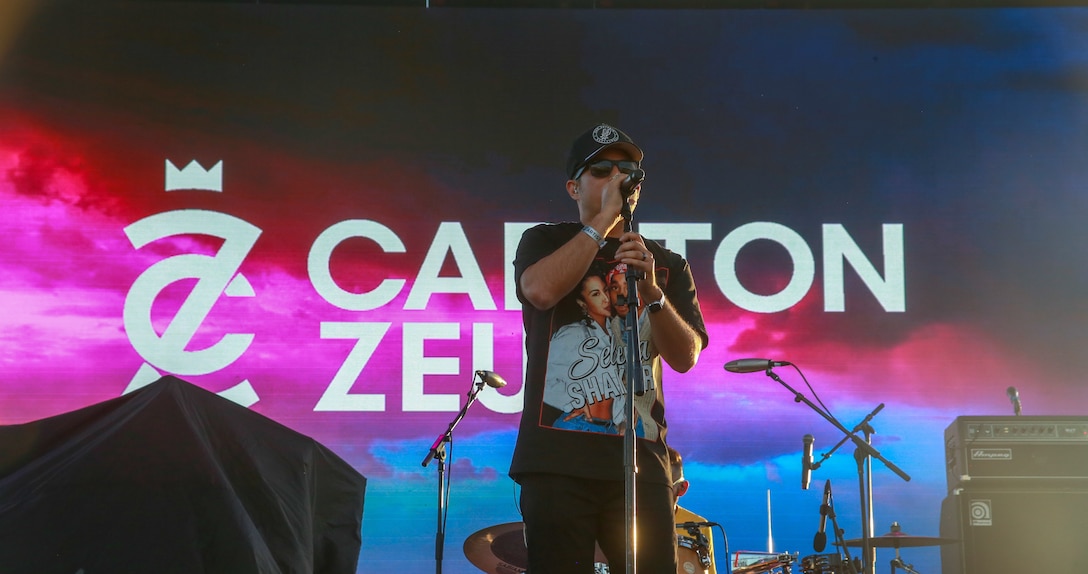 Carlton Zeus, a former Airman turned hip-hop artist, performs during the BaseFest music festival, held at Lance Cpl. Torrey L. Gray Field, aboard the Marine Corps Air Ground Combat Center, Twentynine Palms, Calif., Sept. 22, 2018. Hosted by USAA, with the help of Marine Corps Community Services, BaseFest gave Marines, their families and the local community the opportunity to unwind and listen to live music, while building bonds between the installation and the community. (U.S. Marine Corps photo by Lance Cpl. Dave Flores)
