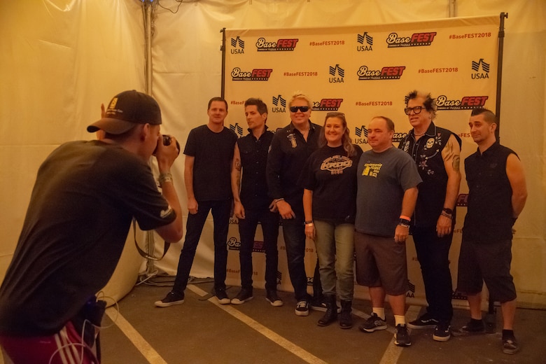 The Offspring, a popular rock band from Southern California, take photos during the fan meet and greet before their performance at the BaseFest music festival held at Lance Cpl. Torrey L. Gray Field aboard the Marine Corps Air Ground Combat Center, Twentynine Palms, Calif., Sept. 22, 2018. Hosted by USAA, with the help of Marine Corps Community Services, BaseFest gave Marines, their families and the local community the opportunity to unwind and listen to live music, while building bonds between the installation and the community. (U.S. Marine Corps photo by Lance Cpl. Dave Flores)