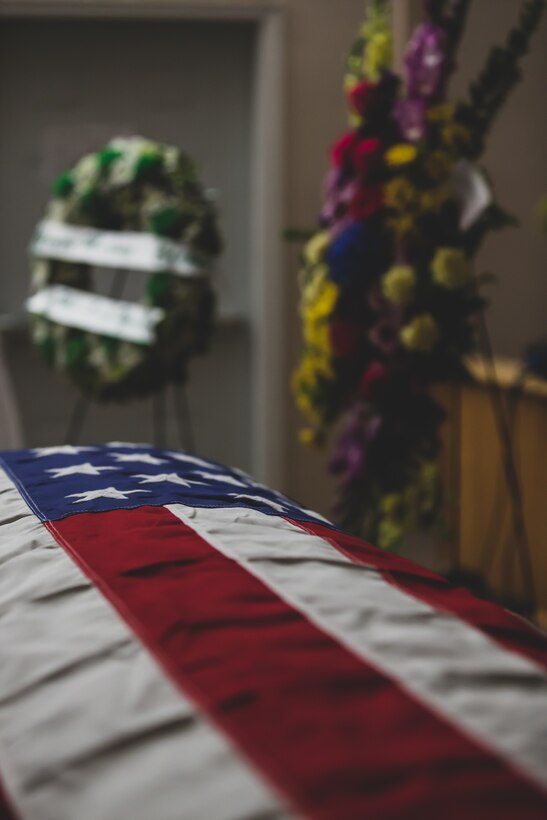 The casket of Tech. Sgt. Dorothy L. Angil was adorned with the United States flag and surrounded by flowers bidding her farewell, at Twentynine Palms United Methodist, Twentynine Palms, Calif., Sept. 22, 2018. Angil enlisted in the Marine Corps in 1943, in support of World War II. She also went on to support the Korean War war effort. (U.S. Marine Corps photo by Lance Cpl. Rachel K. Young)