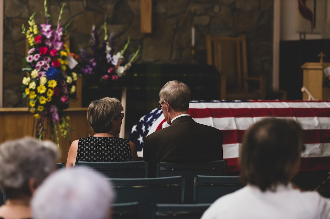 Family members of Tech. Sgt. Dorothy L. Angil reminisce before the beginning of the service at Twentynine Palms United Methodist, Twentynine Palms, Calif., Sept. 22, 2018. Angil enlisted in the Marine Corps in 1943, in support of World War II. She also went on to support the Korean War war effort. (U.S. Marine Corps photo by Lance Cpl. Rachel K. Young)