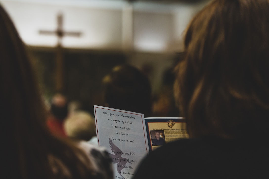 An attendee of Tech. Sgt. Dorothy L. Angil’s funeral reads the eulogy during the ceremony at Twentynine Palms United Methodist, Twentynine Palms, Calif., Sept. 22, 2018. Angil enlisted in the Marine Corps in 1943, in support of World War II. She also went on to support the Korean War war effort. (U.S. Marine Corps photo by Lance Cpl. Rachel K. Young)