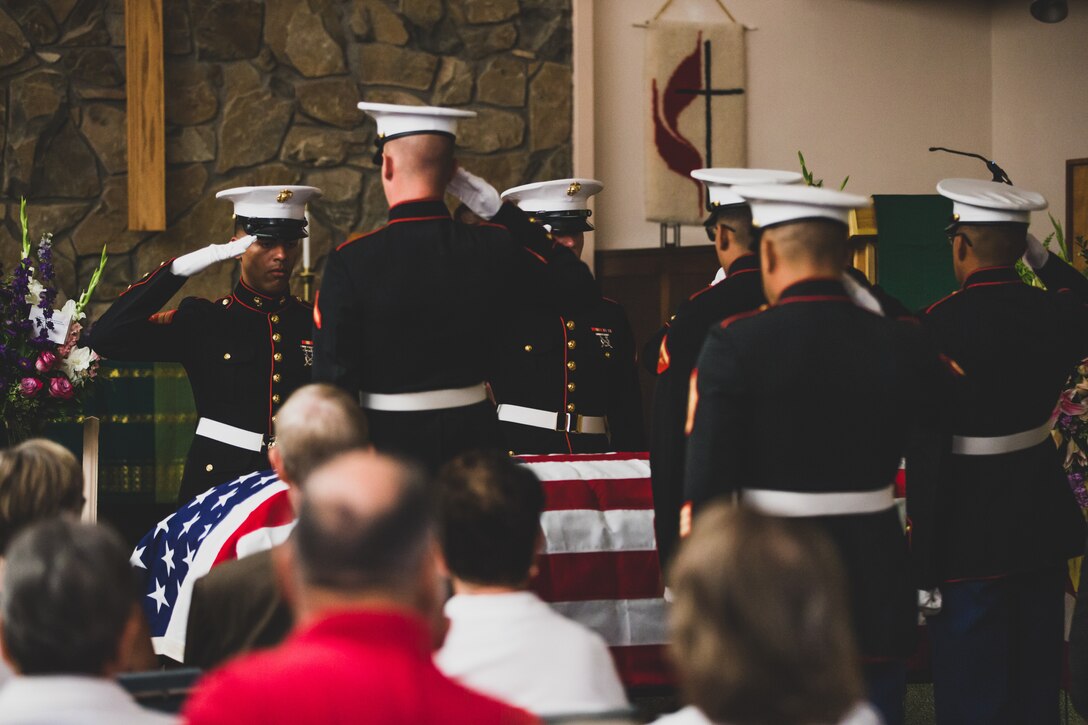 The U.S. Marine Corps Honor Guard presents arms to fallen Tech. Sgt. Dorothy L. Angil at the Twentynine Palms United Methodist, Twentynine Palms, Calif., Sept. 22, 2018. Angil enlisted in the Marine Corps in 1943, in support of World War II. She also went on to support the Korean War war effort. (U.S. Marine Corps photo by Lance Cpl. Rachel K. Young)