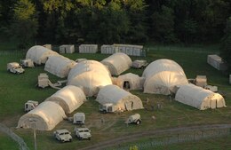 The Early Entry Command Post (EECP) as seen from the air. The 1st TSC has invested over $1 million acquiring tents and other key pieces of equipment for the EECP. The EECP is a key piece in the readiness of First Team, giving the command expeditionary capabilities if required in future missions. (U.S. Army photo by Mr. Brent Thacker)