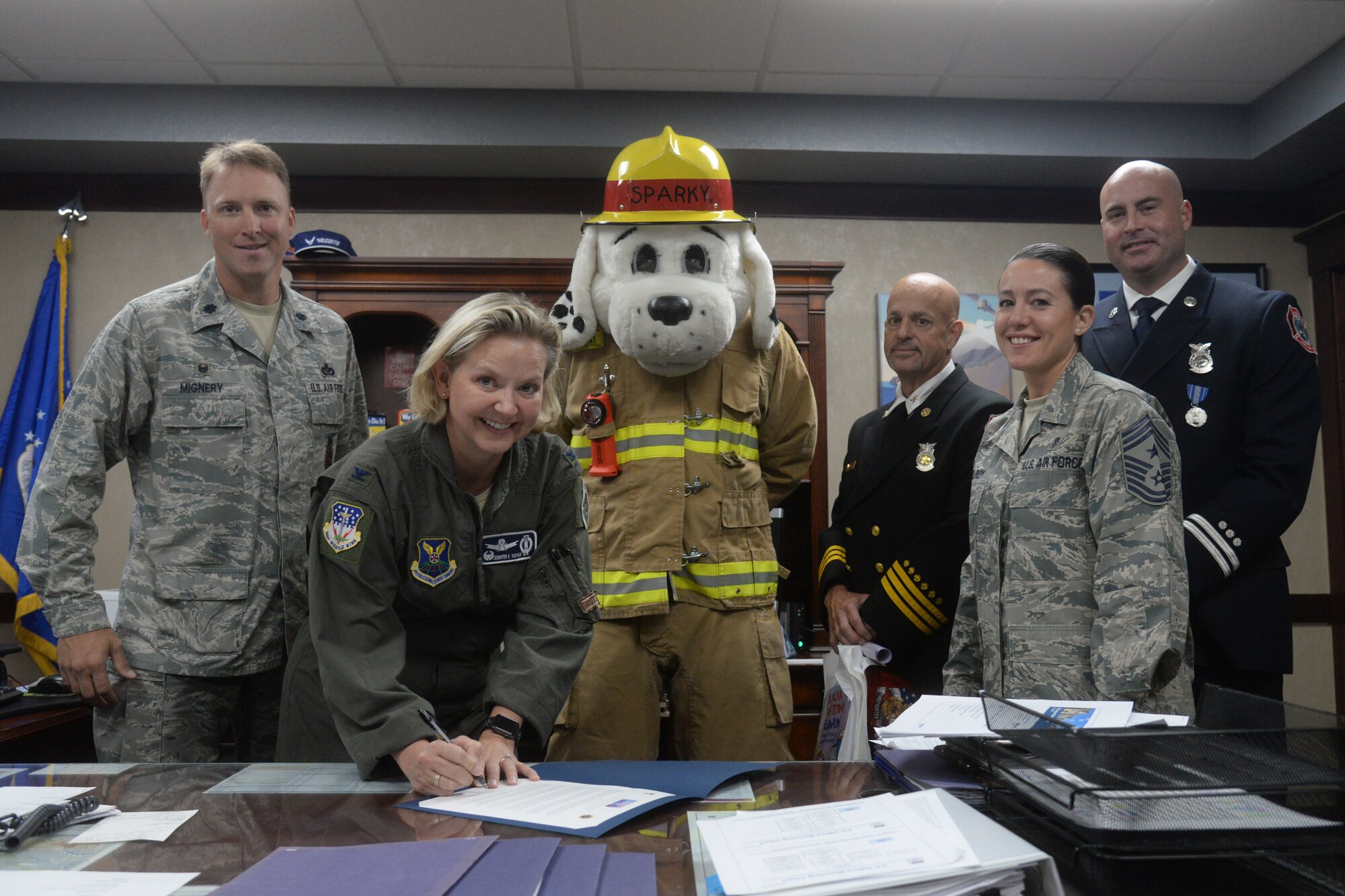 From left to right – Lt. Col. Alex Mignery, 341st Civil Engineer Squadron commander; Col. Jennifer Reeves, 341st Missile Wing commander; Sparky the Fire Dog; Rickey Naccarato, 341st CES assistant fire chief; Chief Master Sergeant Eryn McElroy, 341st MW command chief; and Michael Johns, 341st CES fire inspector, officially recognize Fire Prevention Week as Oct. 7-13 at Malmstrom Air Force Base, Mont., with a signing of a proclamation Sept. 26, 2018. (U.S. Air Force photo by Airman 1st Class Tristan Truesdell)