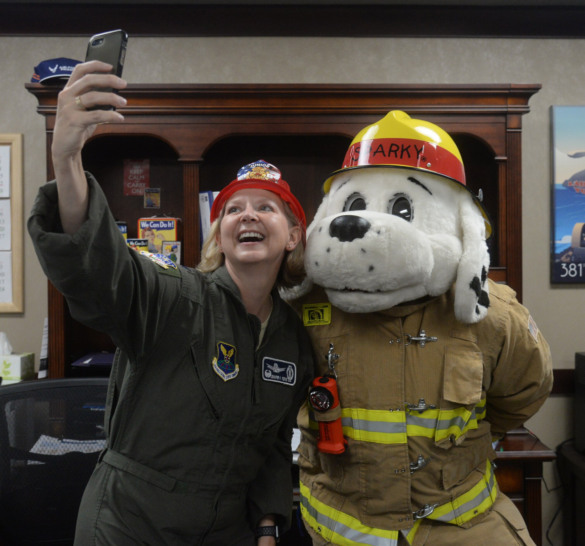 From left to right – Lt. Col. Alex Mignery, 341st Civil Engineer Squadron commander; Col. Jennifer Reeves, 341st Missile Wing commander; Sparky the Fire Dog; Rickey Naccarato, 341st CES assistant fire chief; Chief Master Sergeant Eryn McElroy, 341st MW command chief; and Michael Johns, 341st CES fire inspector, officially recognize Fire Prevention Week as Oct. 7-13 at Malmstrom Air Force Base, Mont., with a signing of a proclamation Sept. 26, 2018. (U.S. Air Force photo by Airman 1st Class Tristan Truesdell)