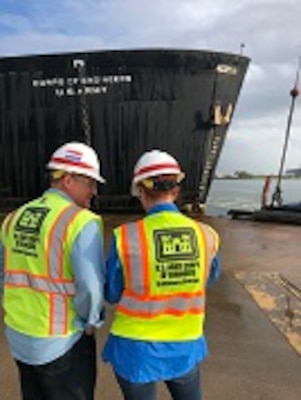 Radiological Health Physicist Hans Honerlah, the program manager for Baltimore District’s Radiological Center of Expertise, and STURGIS decommissioning Project Manager Brenda Barber watch Tuesday morning September 25, 2018 as crews finish the rigging necessary for STURGIS to be towed from Galveston, Texas to Brownsville, Texas for her final shipbreaking and recycling. Over the past three years in Galveston, Texas, the U.S. Army Corps of Engineers has been implementing the challenging and complex efforts to decommission the MH-1A — the deactivated nuclear reactor that was onboard the STURGIS vessel. (Photo by Chris Gardner)