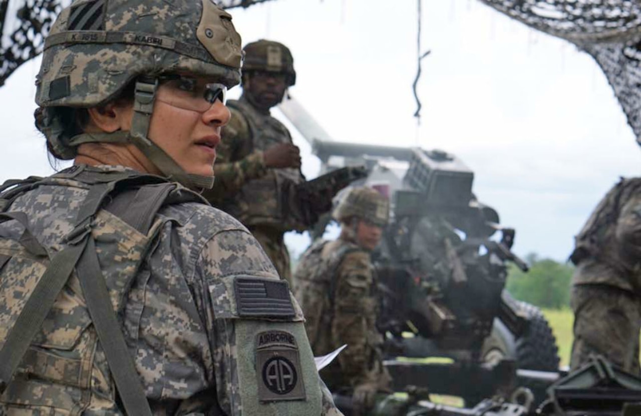 Army Capt. Nargis Kabiri, commander of Alpha Battery, 1st Battalion, 9th Field Artillery Regiment, 3rd Infantry Division Artillery, helps her team prepare an M119 Howitzer on Fort Stewart, Ga.