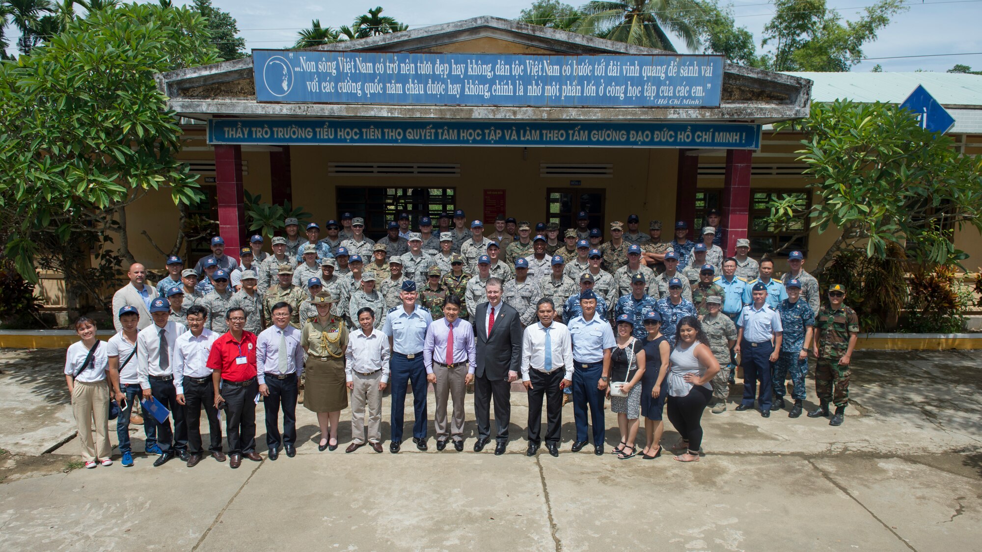 Pacific Angel (PAC ANGEL) 18-2 senior leaders and Vietnam officials pose for a group photo during the event closing ceremony at Tien Tho Primary School, in Tien Tho commune, Tien Phuoc district, Vietnam, Sept. 17, 2018.