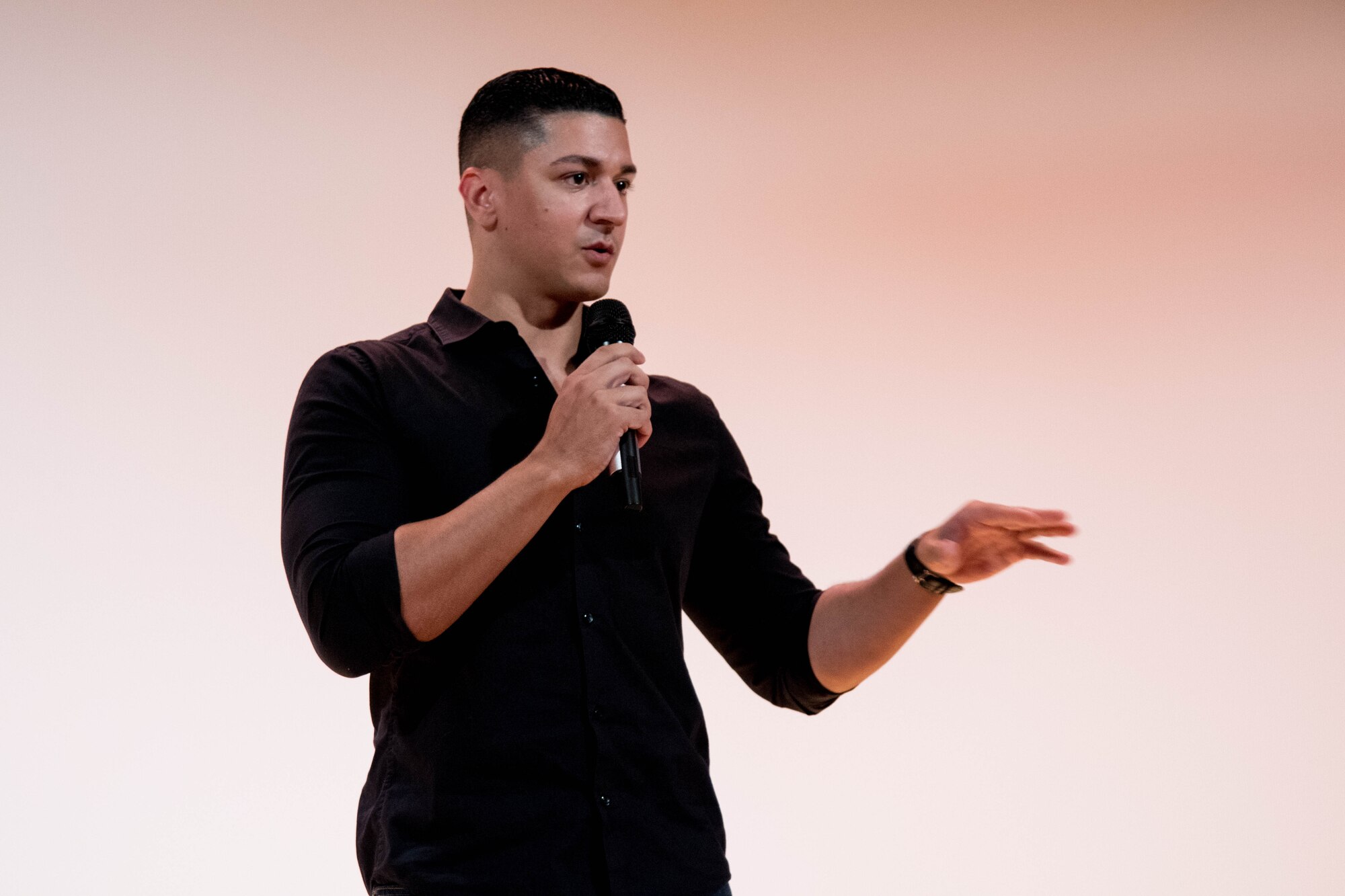 U.S. Air Force Staff Sgt. Stephen Irizarry, 440th Supply Chain Operations Squadron, delivers a poem at the Sexual Assault Prevention Response event “Creating Change Through Art” held at the Langley Air Force Base Theater, Virginia, Sept. 25, 2018. Irizarry wrote the poem in honor of a personal friend who fought through several emotions after being sexually assaulted. (U.S. Air Force Photo by Senior Airman Ericha Guyote/Released)