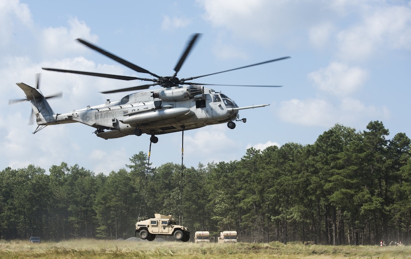 A U.S. Marine Corps CH-53E Super Stallion lifts a U.S. Army Humvee during a joint training exercise near Joint Base McGuire-Dix-Lakehurst, New Jersey, Sept. 6, 2018. Marine Heavy Helicopter Squadron 772 (HMH-772) worked with 101st Airborne Division to train on sling loading procedures and reconnaissance training. (U.S. Air Force photo by Airman Ariel Owings)
