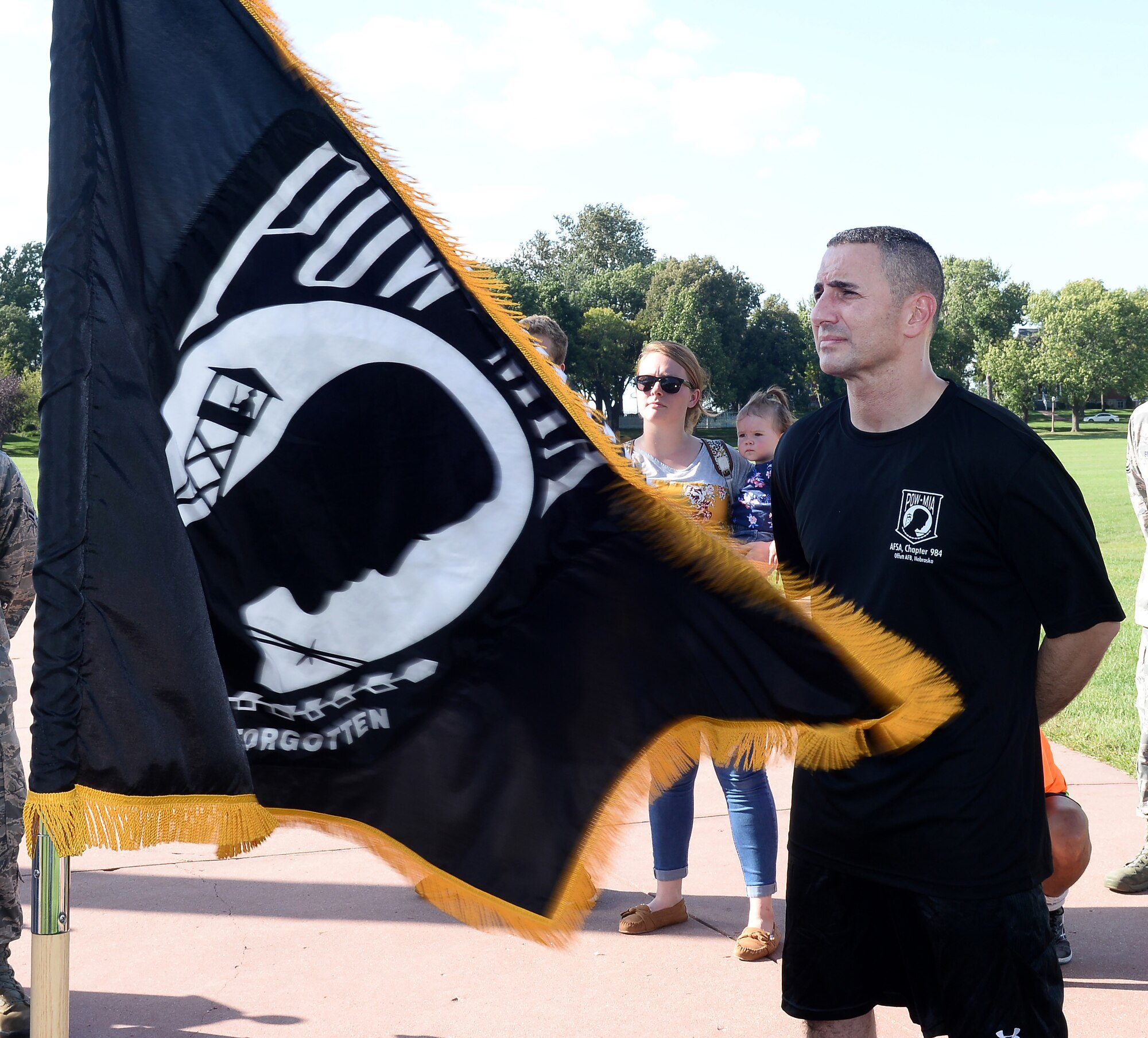 Chief Master Sgt. Brian Kruzelnick, 55th Wing command chief, listens to U.S. Air Force Colonel Michael Manion, 55th Wing commander, give opening remarks, during the POW/MIA 24-Hour Vigil Run Sept. 14, 2018, at Offutt Air Force Base, Nebraska. Many Americans across the United States pause on the third Friday of September each year to remember the sacrifices and service of those who were POWs as well as those who are MIA and their families. (U.S. Air Force Photo by Charles J. Haymond)