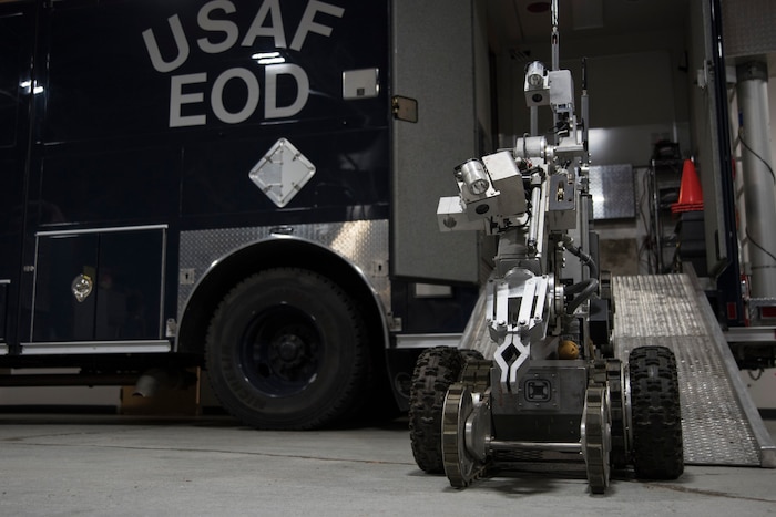 A robot sits outside an emergency vehicle.