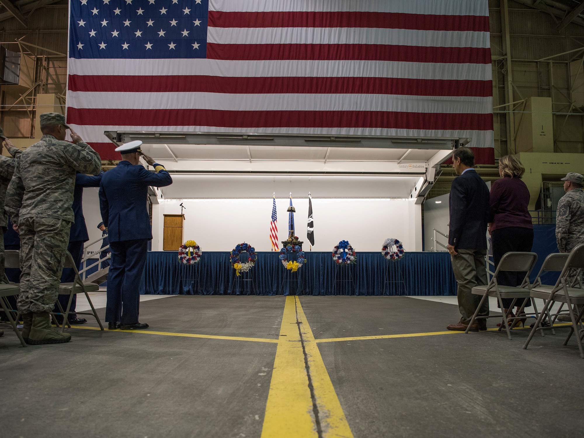 Joint Base Elmendorf-Richardson service members salute during a POW/MIA recognition ceremony at Hangar 1, JBER, Alaska, Sept. 21, 2018. POW/MIA recognition day is observed every year on the third Friday in September and honors those who were prisoners of war and those who are still missing in action.