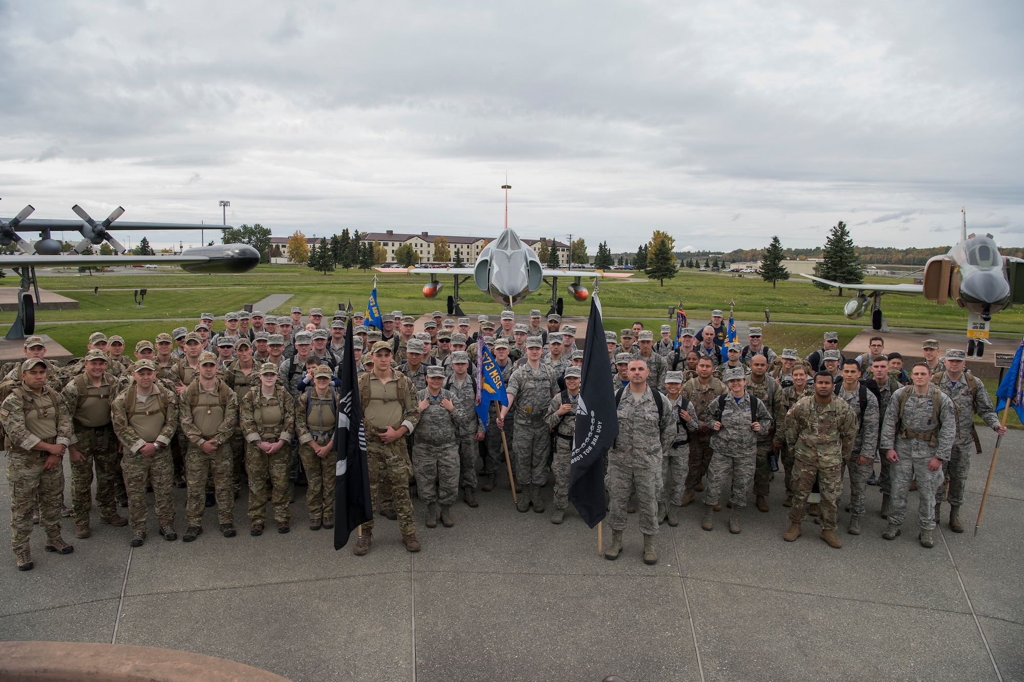 A large group of Joint Base Elmendorf-Richardson service members participate in a POW/MIA ruck march through JBER, Alaska, Sept. 21, 2018. Personnel carried canned food in their packs during the march and donated it to the Armed Services YMCA of Alaska. Service members also attended a POW/MIA recognition ceremony.