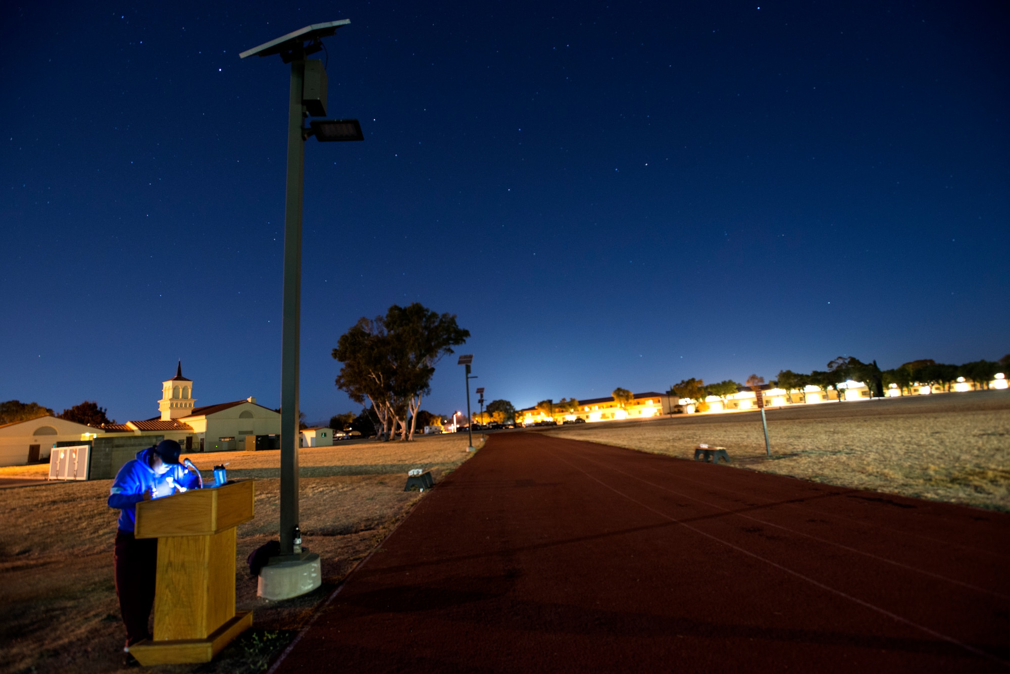 A prompter reads off names of POW/MIA service members during the POW/MIA Recognition Day ceremony run at Travis Air Force Base, Calif., on Sept. 21, 2018. Team Travis Airmen kept the American and POW/MIA flags in constant motion for 24 hours straight in honor of American prisoners of war and those missing in action.