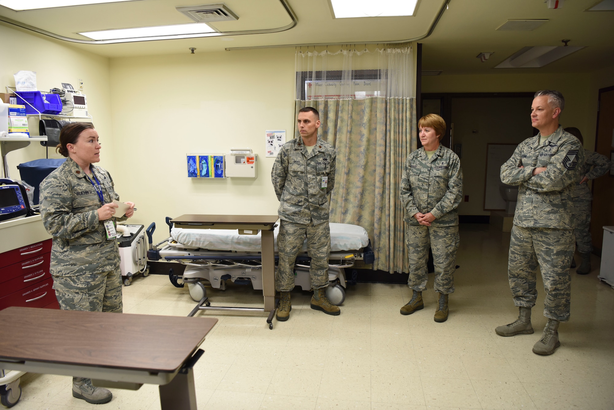 U.S. Air Force Maj. Michelle Buehner, left, 51st Medical Operation Squadron general surgeon, and U.S. Air Force Maj. Douglas Savey, center, 51st Medical Operation Squadron certified registered nurse anesthetist, brief U.S. Air Force Lt. Gen. Dorothy Hogg, Air Force Surgeon General, and U.S. Air Force Chief Master Sgt. Steven Cum, Medical Enlisted Force and Enlisted Corps chief, about the functions of the operating room at Osan Air Base, Republic of Korea, Sept. 24, 2018.