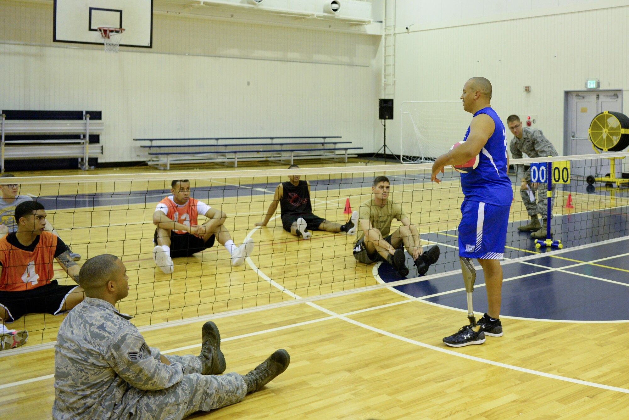 Master Sgt. Brian Williams, 341st Training Squadron operations superintendent, Lackland Air Force Base, TX, explained the rules of sitting volleyball Sept. 26, 2018, at Yokota Air Base, Japan.