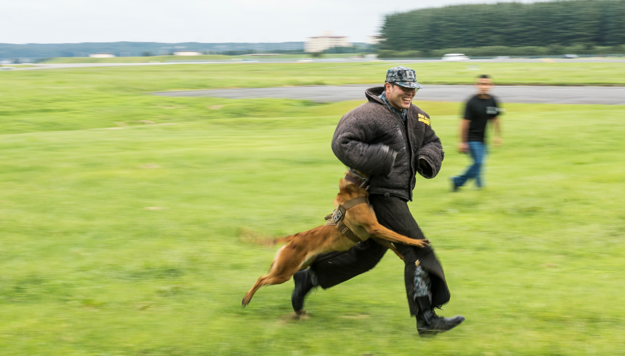 Japan Air Self-Defense Force Staff Sgt. Daigoro Tanaka, aircraft combat warning technician assigned with Otakineyama Detachment, Japan, engages in bite training