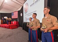 U.S. Marines and a U.S. Navy Chief Hospital Corpsman receive awards from Gen. Robert Neller, commandant of the Marine Corps, and Sgt. Maj. of the Marine Corps Ronald Green, at the 36th annual United States Marine Corps Enlisted Awards Parade and Presentation on Marine Corps Base Quantico, Va., Sept. 26, 2018. The presentation is held to recognize individual achievements of enlisted Marines and Sailors throughout the Marine Corps. (U.S. Marine Corps photo by James H. Frank)