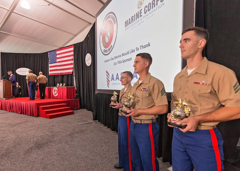 U.S. Marines and a U.S. Navy Chief Hospital Corpsman receive awards from Gen. Robert Neller, commandant of the Marine Corps, and Sgt. Maj. of the Marine Corps Ronald Green, at the 36th annual United States Marine Corps Enlisted Awards Parade and Presentation on Marine Corps Base Quantico, Va., Sept. 26, 2018. The presentation is held to recognize individual achievements of enlisted Marines and Sailors throughout the Marine Corps. (U.S. Marine Corps photo by James H. Frank)