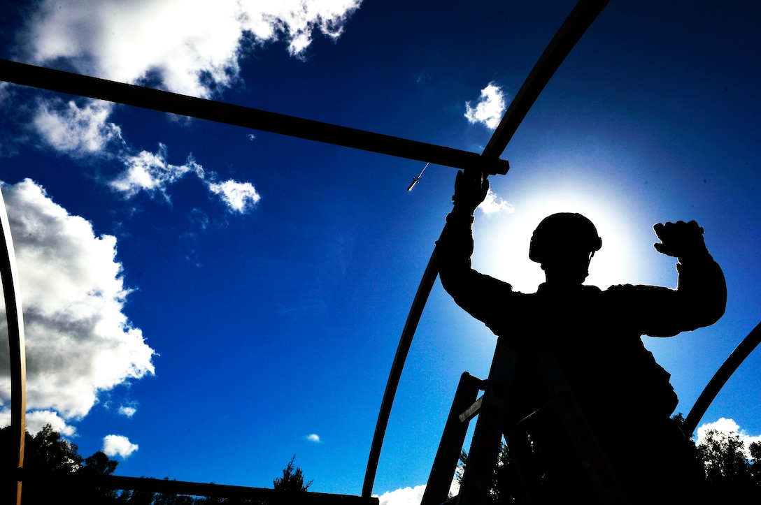 U.S. Air Force Tech. Sgt. Joshua Todd, 435th Contingency Response Squadron training manager, sets up a frame while helping build a tent Ramstein Air Base, Germany, Sept. 25, 2018. Airmen assigned to the 435th Contingency Response Group come from a variety of Air Force specialty codes train in numerous contingency response tasks. (U.S. Air Force photo by Senior Airman Joshua Magbanua)