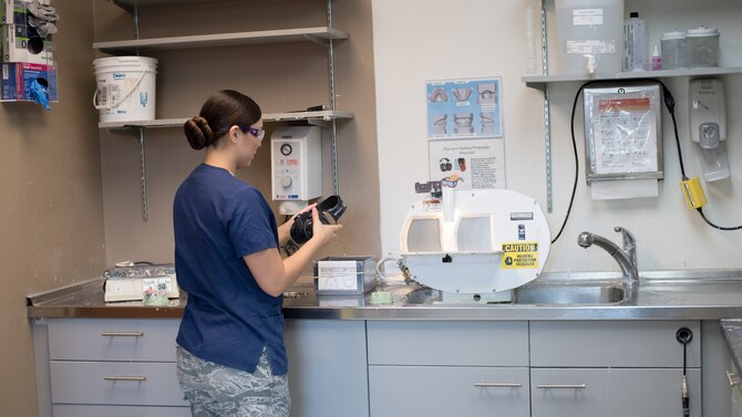 Staff Sgt. Kimberly Conklin, 2nd Dental Squadron dental laboratory NCO in-charge, finishes creating a cast of teeth at Barksdale Air Force Base, La., Aug. 30, 2018. Technicians use a material called “stone” to fill impressions. When the stone hardens, it creates a mold of the patient’s teeth. (U.S. Air Force photo by Senior Airman Stuart Bright)