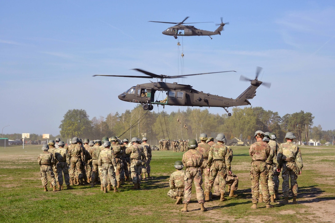 Soldiers wait to rappel from UH-60M Black Hawk helicopters during an air assault course.