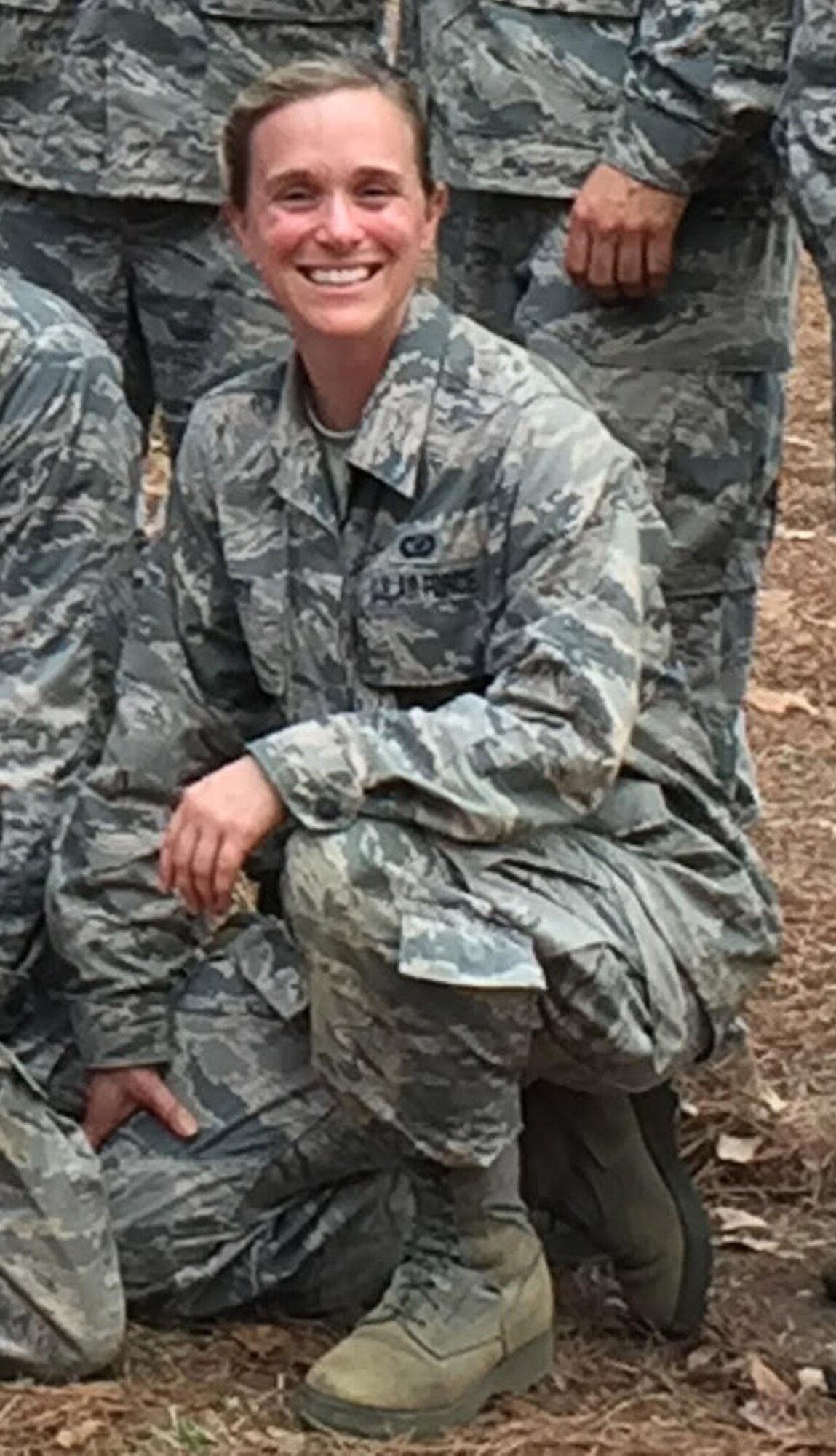 Cadet Callie McNary, 507th Air Refueling Wing public affairs specialist from Tinker Air Force Base, Oklahoma, takes a group photo with her flight upon finishing an obstacle course during Officer Training School Feb. 21, 2018, at Maxwell Air Force Base, Alabama. (U.S. Air Force courtesy photo)