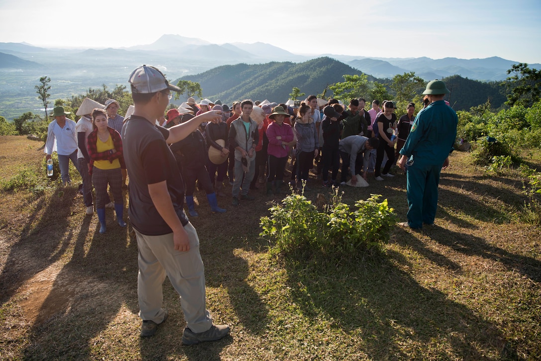 Translator talks with local people in Vietnam.