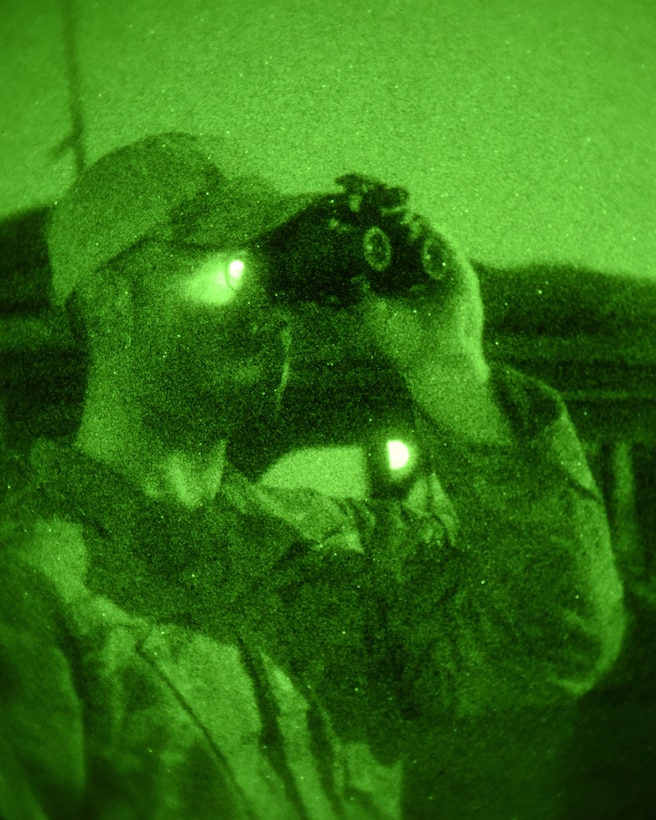Maj. Andrew Huddleston, 4th Air Support Operations Squadron air mobility liaison officer, watches airdrops during Saber Junction 18, Germany, Sept. 20, 2018. As an AMLO, Huddleston provided assistance to the U.S. Army ensuring the U.S. Air Force support for Saber Junction 18. The exercised focused on validating Army training objectives and building trust between allied and partenered nations. (U.S. Air Force Photo by Staff Sgt. Lauren O'Connor)