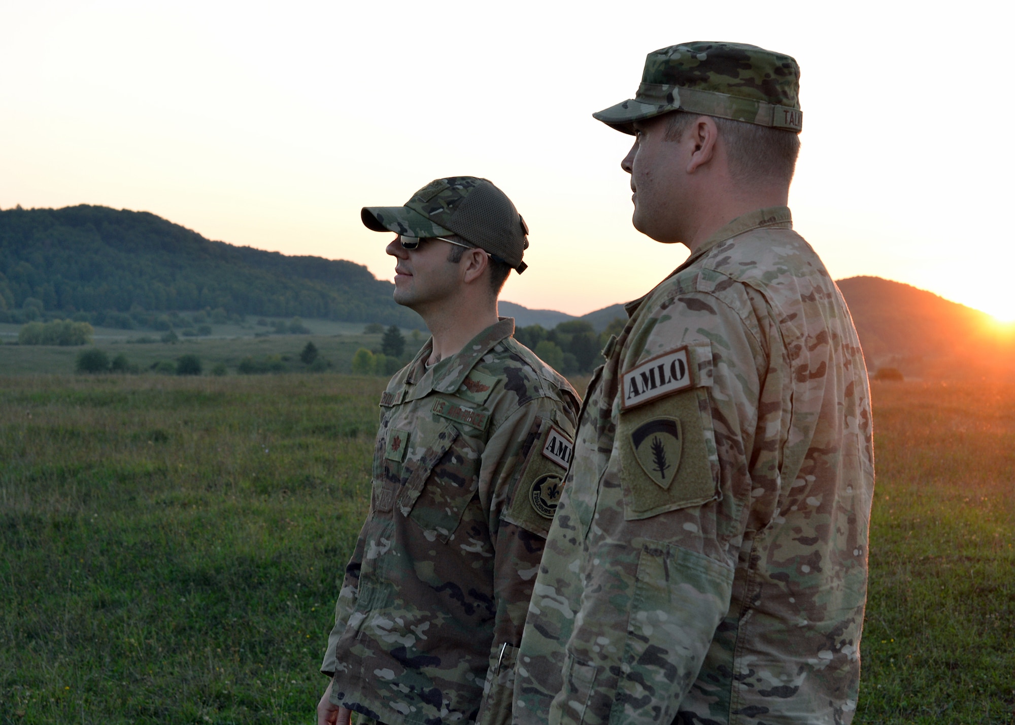 Left, Maj. Andrew Huddleston, 4th Air Support Operations Squadron air mobility liaison officer, and Maj. Jack Talkington, 4th Air Support Operations Group AMLO, scan for aircraft during Saber Junction 18 in Germany, Sept. 20, 2018. Huddleston and Talkington were responsible for communicating between the Air Force and Army components to ensure the exercise met tactical training plans safely. (U.S. Air Force photo by Staff Sgt. Jimmie D. Pike)