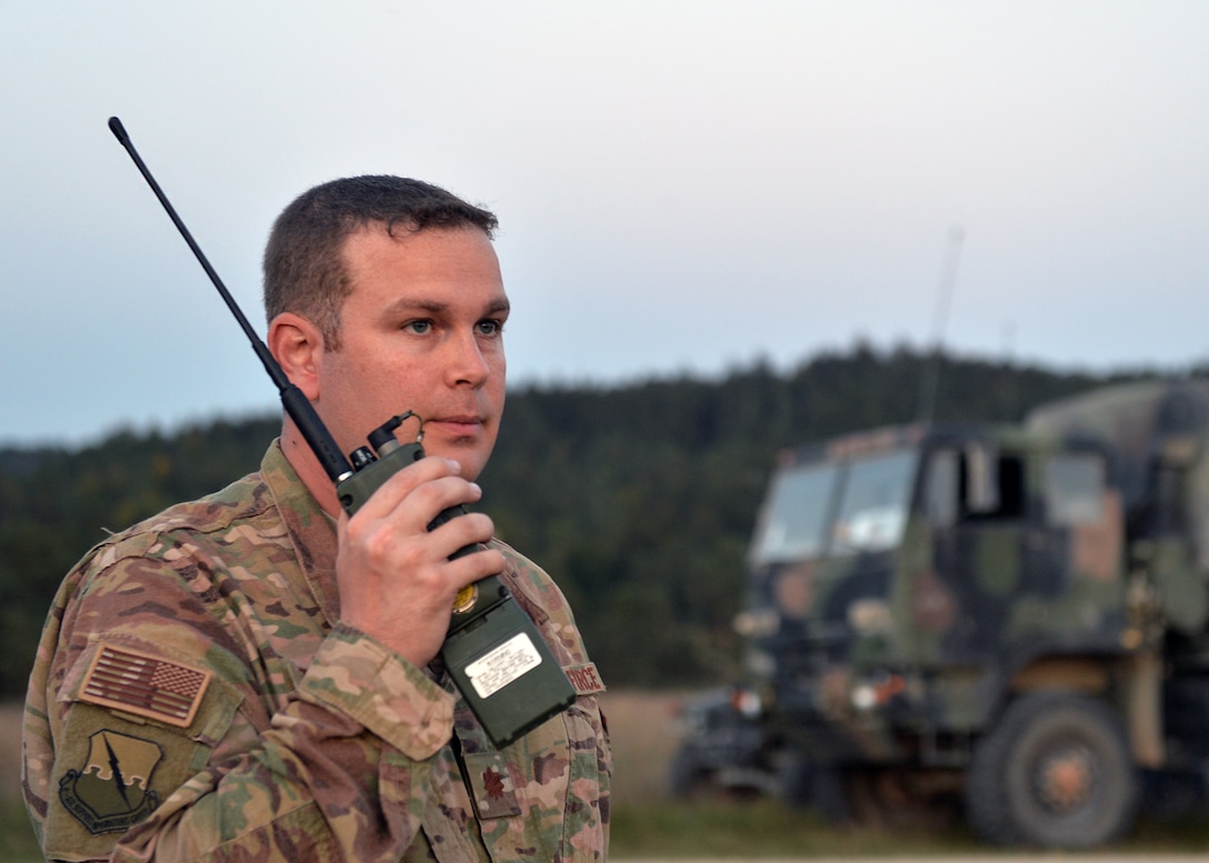 Maj. Jack Talkington, 4th Air Support Operations Group air mobility liaison officer, listens to radio during Saber Junction 18 in Germany, Sept. 20, 2018. As a liaison between the air and ground components, Talkington helped with the planning and development of operations of SJ18. (U.S. Air Force photo by Staff Sgt. Jimmie D. Pike)