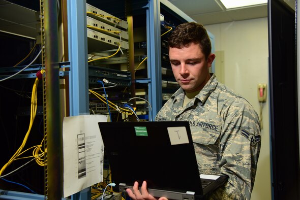 Airman 1st Class Beau Cantrell, 47th Communications Squadron cyber transport technician, logs in to a “switch” to check the configuration in a server room, Sept. 24, 2018, at Laughlin Air Force Base, Texas. Cantrell, hailing from Hot Springs, Arkansas, attacked a critical network error that affected more than 1,700 computers at Laughlin. He was able to identify and address what went wrong, restoring internet for 22 units in less than three days. (U.S. Air Force photo by Airman 1st Class Marco A. Gomez)