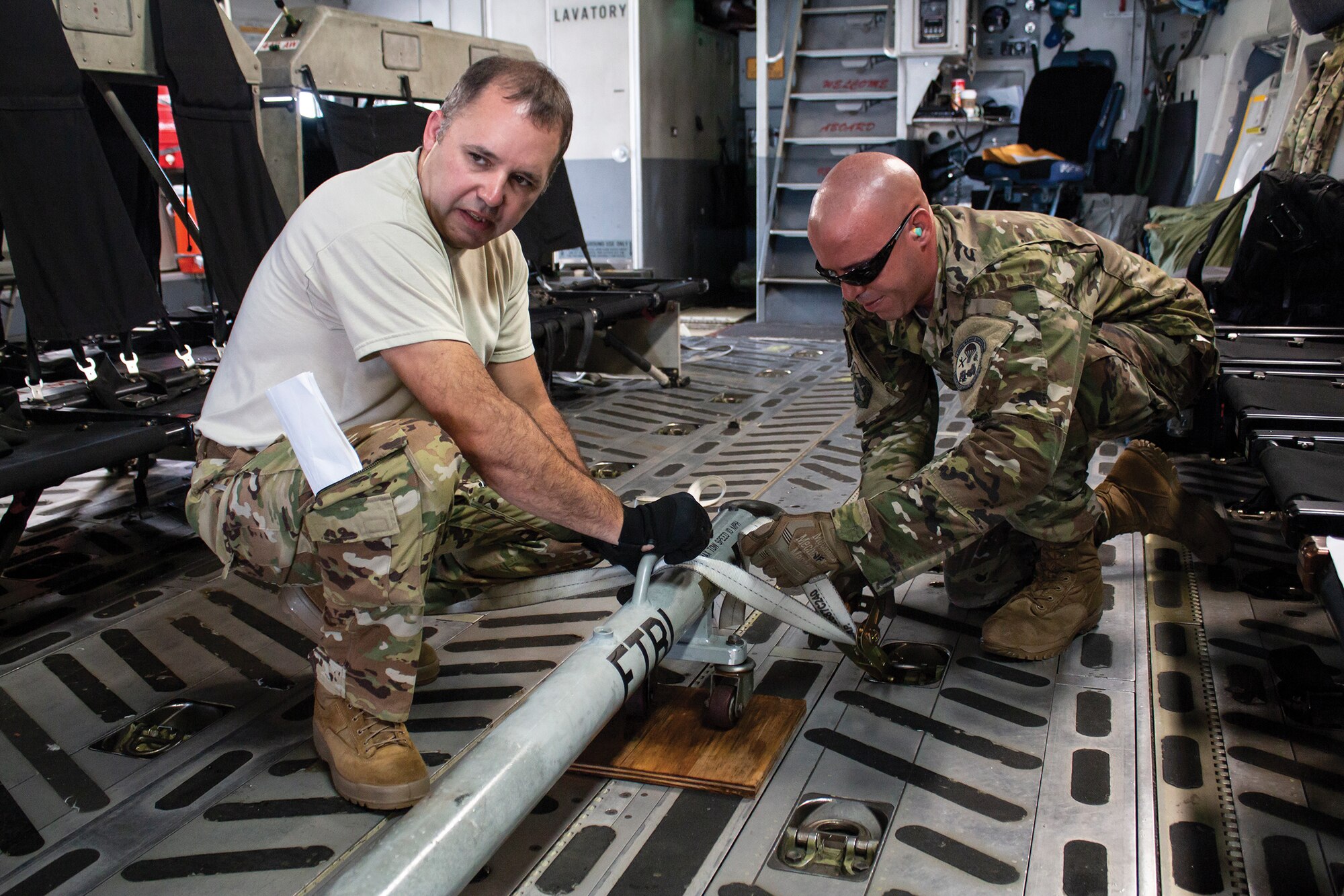 (left) Chief Master Sgt. Jason LeMaster, 89th Airlift Squadron loadmaster  and Senior Airman Nathan Edwards, 920th Logistics Readiness Squadron aerial delivery air transportation specialist, load equipment onto a 445th Airlift Wing C-17 Globemaster III Sept. 13, 2018. The wing delivered members of the 920th Rescue Wing, Patrick Air Force Base, Florida, and equipment to Moody Air Force Base, Georgia.